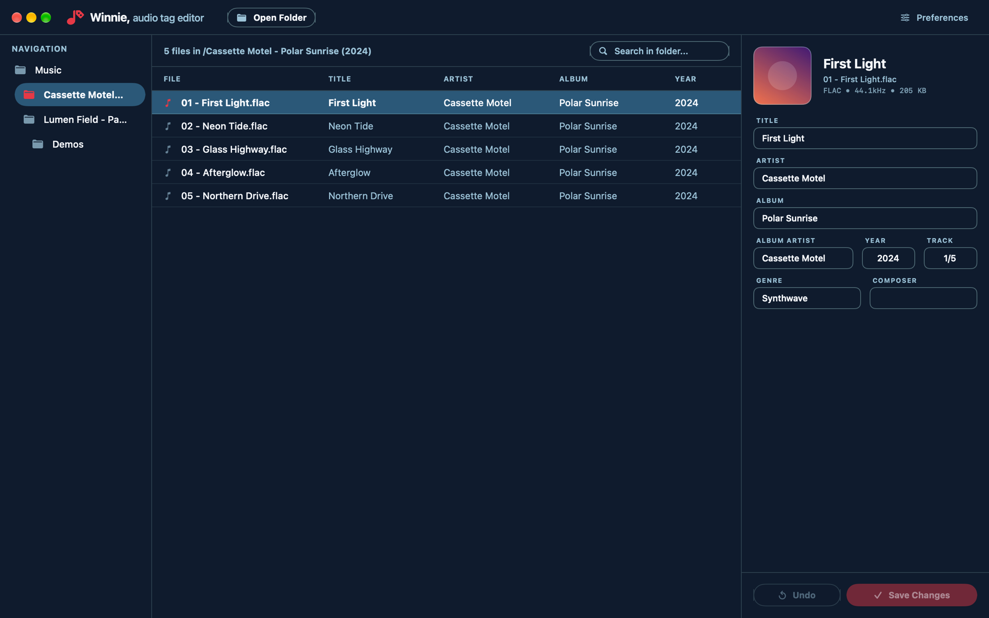 Winnie in dark appearance, showing the same album and tag editor on a dark navy background.